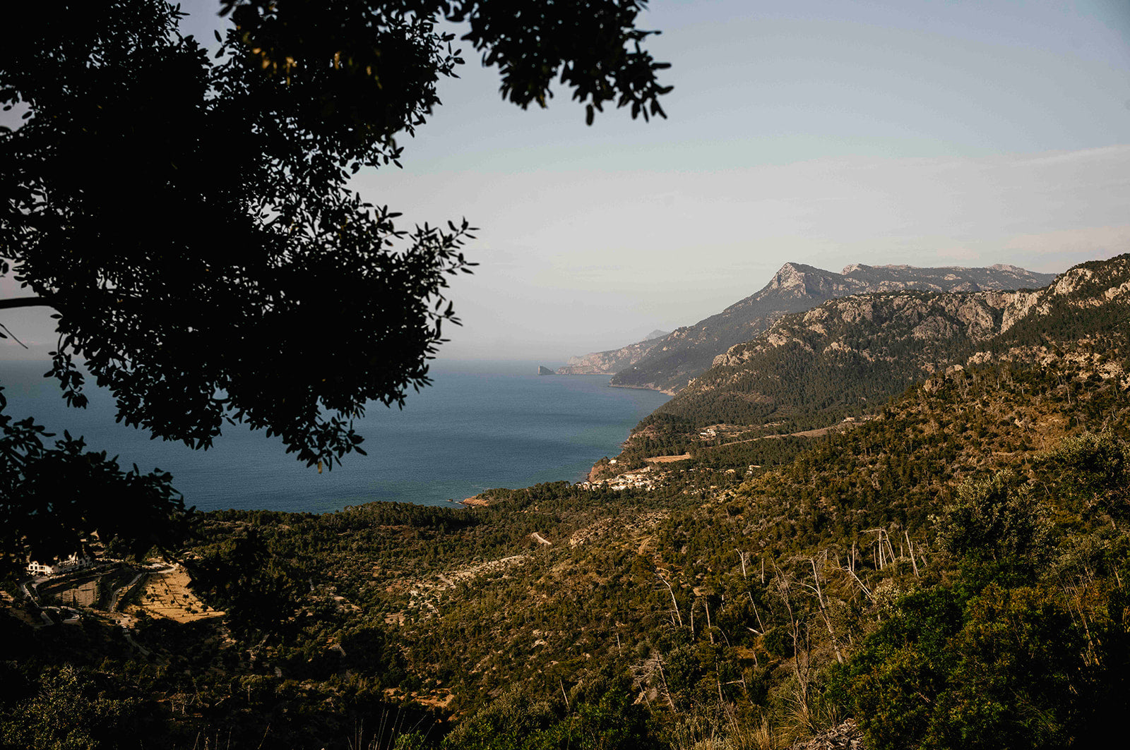 Scenic view of Mallorca's coastal landscape with mountains and sea from a high vantage point.